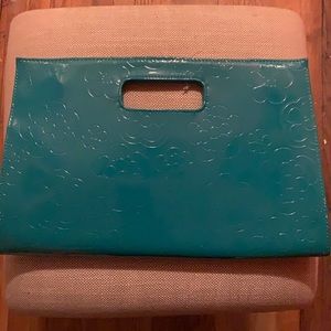 Teal blue/with flower print clutch purse.Never worn